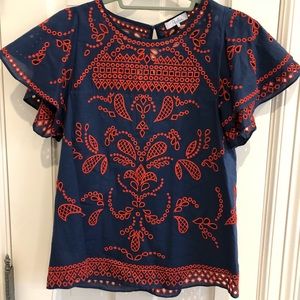 Navy blouse with red embroidery